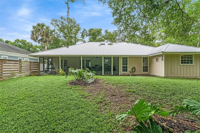435 61st Ave, Vero Beach, FL 32968 - back of property featuring a sunroom and metal roof