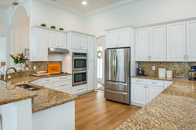 kitchen featuring white cabinetry, appliances with stainless steel finishes, and stone counters