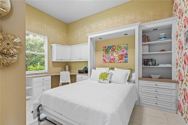 919 Island Club Sq, Vero Beach, FL 32963 - bedroom with built in desk and light tile patterned floors