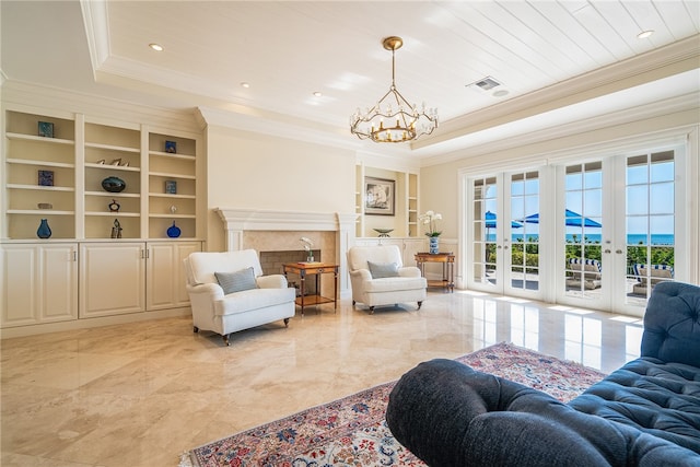 living room with a high end fireplace, french doors, built in shelves, wooden ceiling, and a raised ceiling