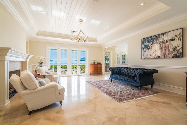 living area featuring french doors, a wealth of natural light, and a tray ceiling