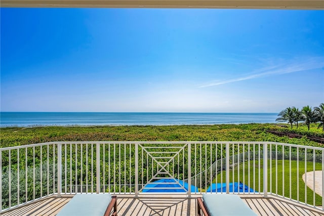 balcony featuring a water view