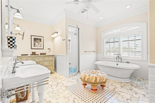 bathroom with ceiling fan, ornamental molding, separate shower and tub, and tile walls