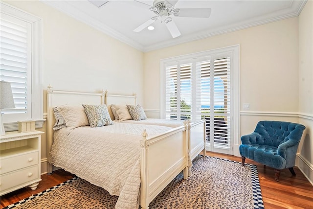 bedroom with crown molding, ceiling fan, dark hardwood / wood-style floors, and access to outside