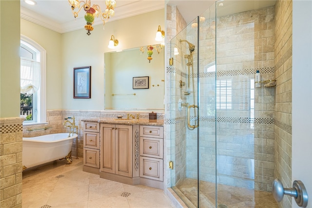 bathroom featuring tile patterned flooring, tile walls, vanity, ornamental molding, and shower with separate bathtub