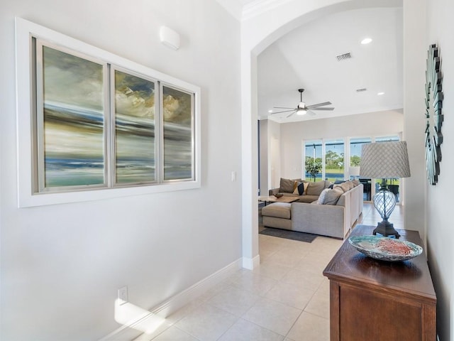 hallway featuring visible vents, recessed lighting, arched walkways, light tile patterned flooring, and baseboards