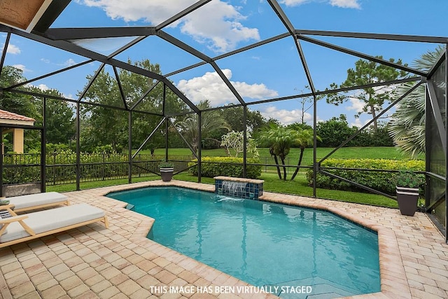 view of swimming pool featuring pool water feature, glass enclosure, a patio area, and a yard