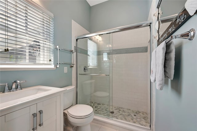 bathroom featuring tile patterned flooring, plenty of natural light, and an enclosed shower