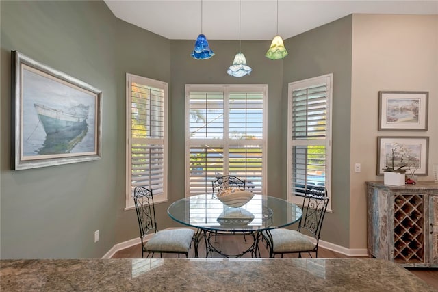 dining space featuring wood-type flooring