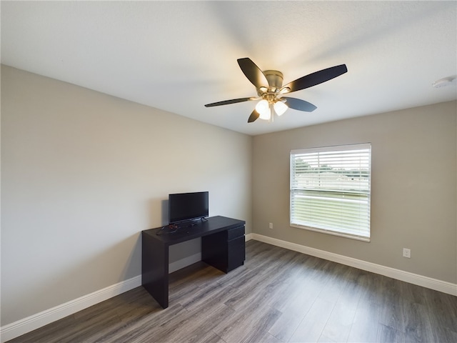 home office with hardwood / wood-style flooring and ceiling fan