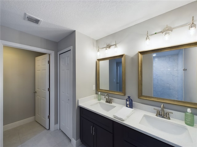 bathroom featuring vanity and a textured ceiling