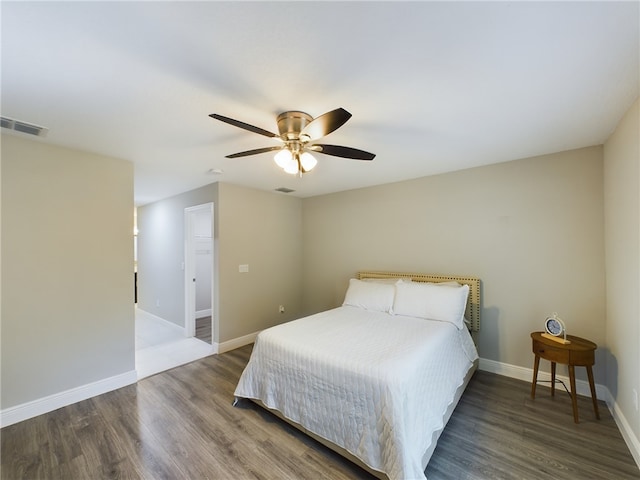 bedroom featuring dark wood-type flooring and ceiling fan