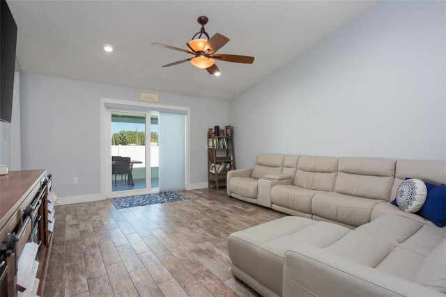 living room with lofted ceiling, wood-type flooring, and ceiling fan