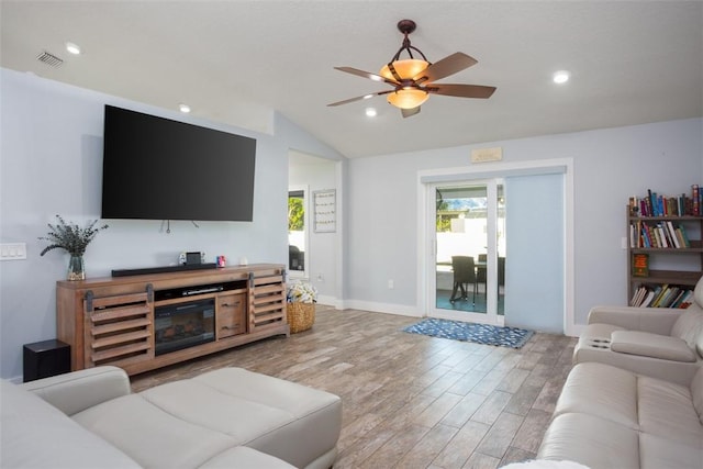 living room with lofted ceiling, wood-type flooring, and ceiling fan