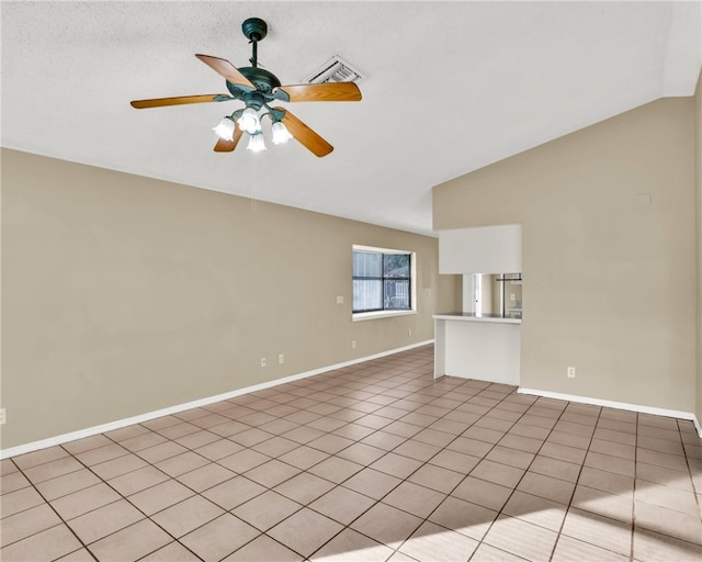 unfurnished living room featuring a textured ceiling, ceiling fan, light tile patterned floors, and vaulted ceiling