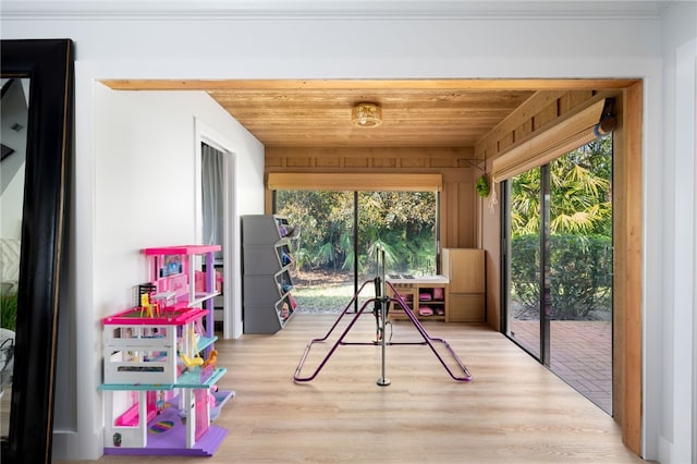 sunroom featuring wood ceiling and a wealth of natural light