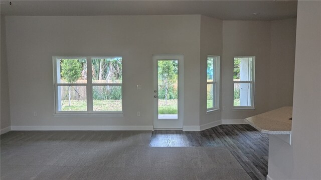 532 S Easy St, Sebastian, FL 32958 - unfurnished room with healthy amount of natural light, baseboards, and dark carpet