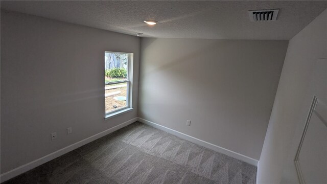 532 S Easy St, Sebastian, FL 32958 - empty room featuring carpet flooring, baseboards, and a textured ceiling