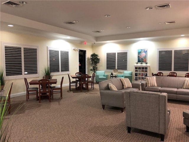 carpeted living room featuring recessed lighting, visible vents, and baseboards