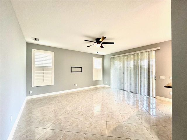 1886 Grey Falcon Cir SW, Vero Beach, FL 32962 - spare room featuring ceiling fan, baseboards, and visible vents