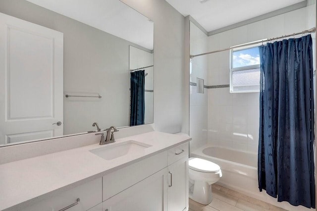 full bathroom featuring tile patterned floors, vanity, toilet, and shower / bathtub combination with curtain