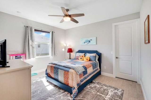 bedroom featuring ceiling fan and light hardwood / wood-style floors