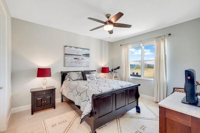 bedroom featuring light hardwood / wood-style flooring and ceiling fan