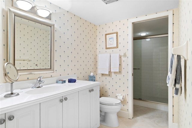 bathroom featuring vanity, tile patterned floors, toilet, and a shower with door