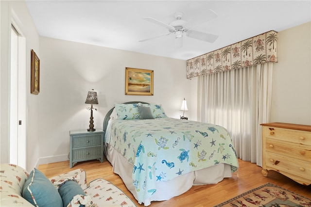 bedroom featuring hardwood / wood-style floors and ceiling fan