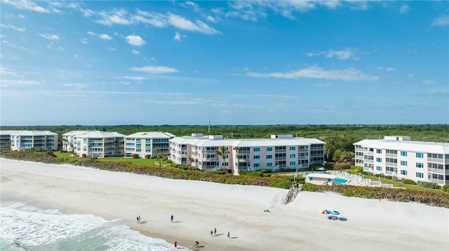 bird's eye view featuring a beach view and a water view