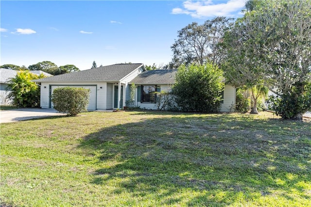 ranch-style home with a garage and a front lawn