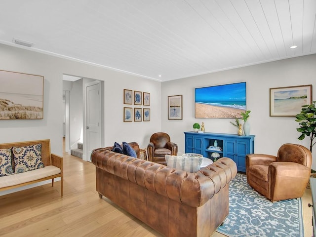 living room with light hardwood / wood-style flooring and wooden ceiling