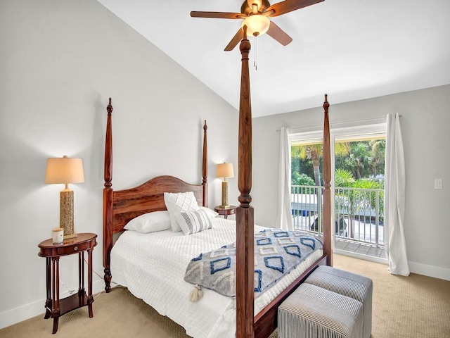 carpeted bedroom with ceiling fan, vaulted ceiling, and access to exterior