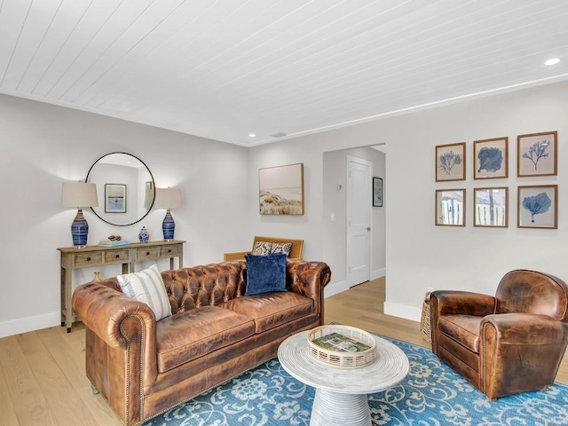 living room with wood ceiling and light hardwood / wood-style flooring