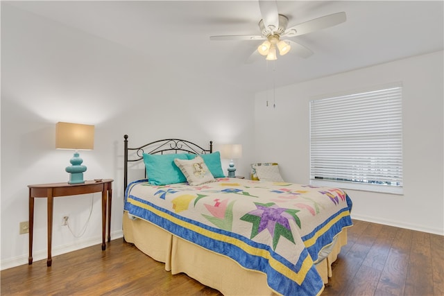 bedroom with ceiling fan and dark hardwood / wood-style flooring