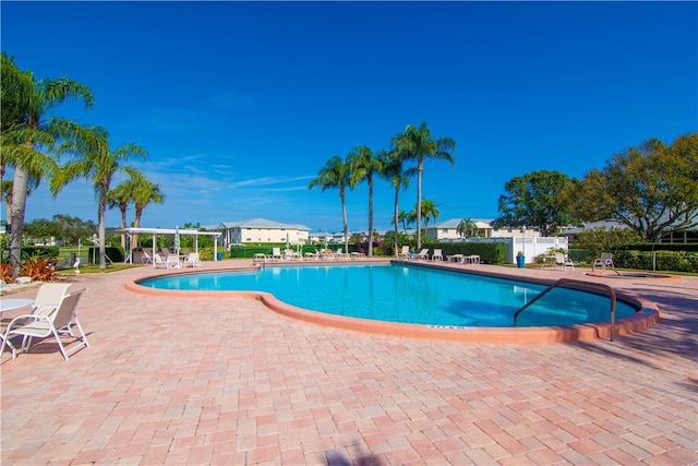 view of pool featuring a pergola and a patio