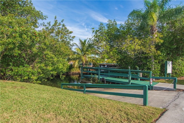 view of home's community featuring a lawn