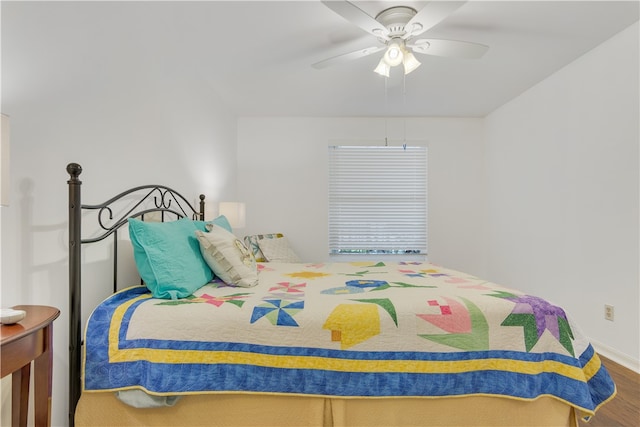 bedroom featuring ceiling fan and hardwood / wood-style flooring