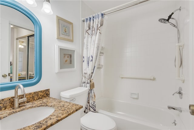 full bathroom with toilet, vanity, and shower / tub combo