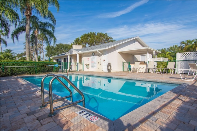 view of swimming pool with a patio area