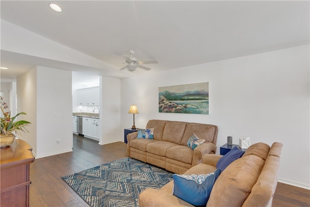 living room with ceiling fan, dark wood-type flooring, sink, and lofted ceiling