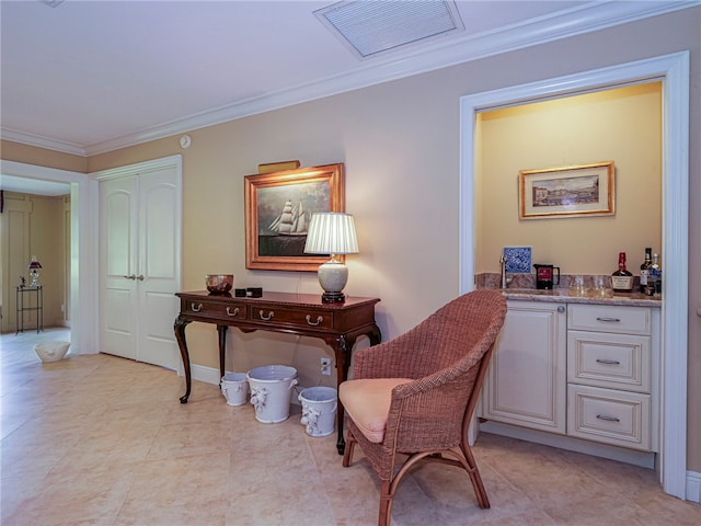 office area featuring indoor bar and ornamental molding