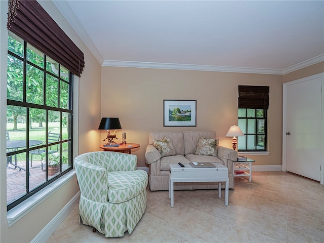 tiled living room featuring a wealth of natural light and ornamental molding