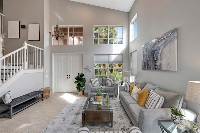 living room featuring high vaulted ceiling, an inviting chandelier, and light tile patterned flooring