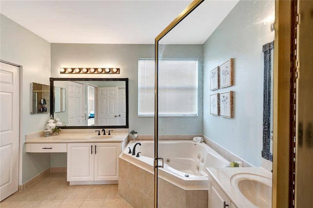 bathroom featuring a relaxing tiled tub, tile patterned flooring, and vanity