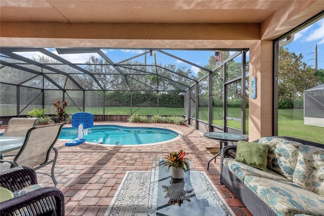 view of swimming pool with glass enclosure and a patio