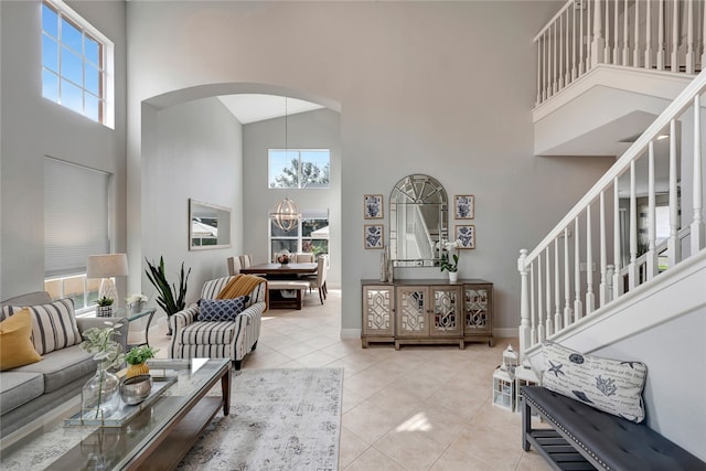 living room with high vaulted ceiling and a wealth of natural light