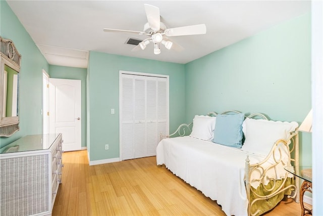 1401 Saint Davids Ln, Vero Beach, FL 32967 - bedroom featuring a closet, light wood finished floors, baseboards, and a ceiling fan