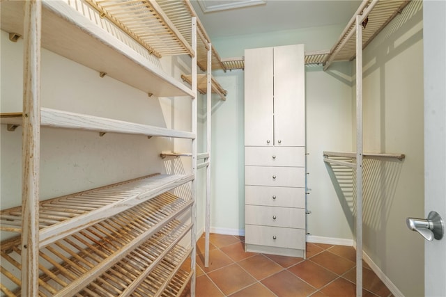 spacious closet with tile patterned floors