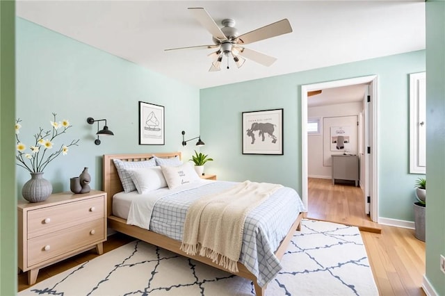 1401 Saint Davids Ln, Vero Beach, FL 32967 - bedroom with wood finished floors, baseboards, and a ceiling fan